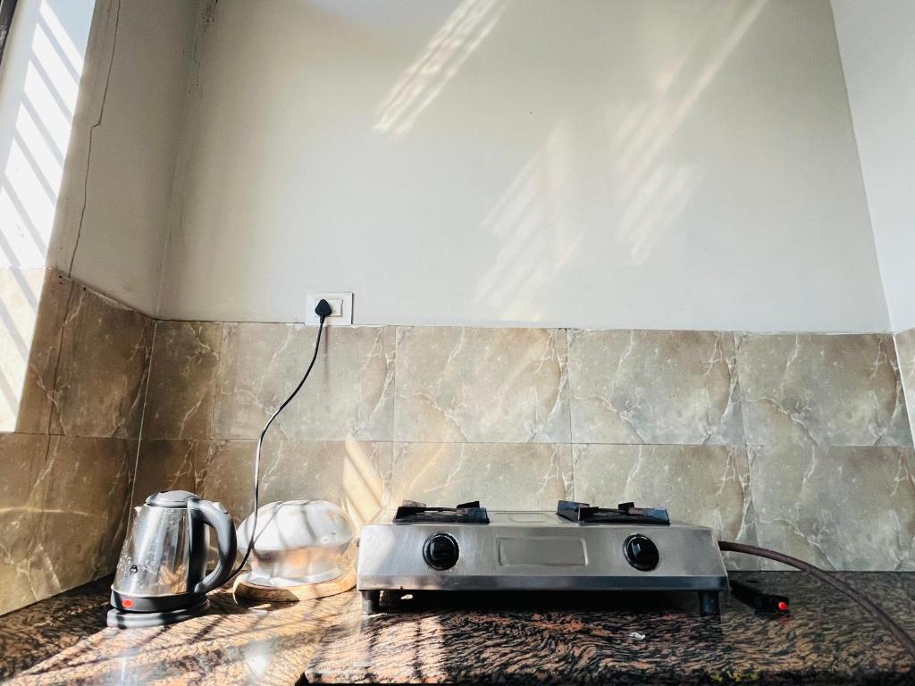a toaster sitting on a counter in a kitchen at Retro By Alhanney in Guwahati