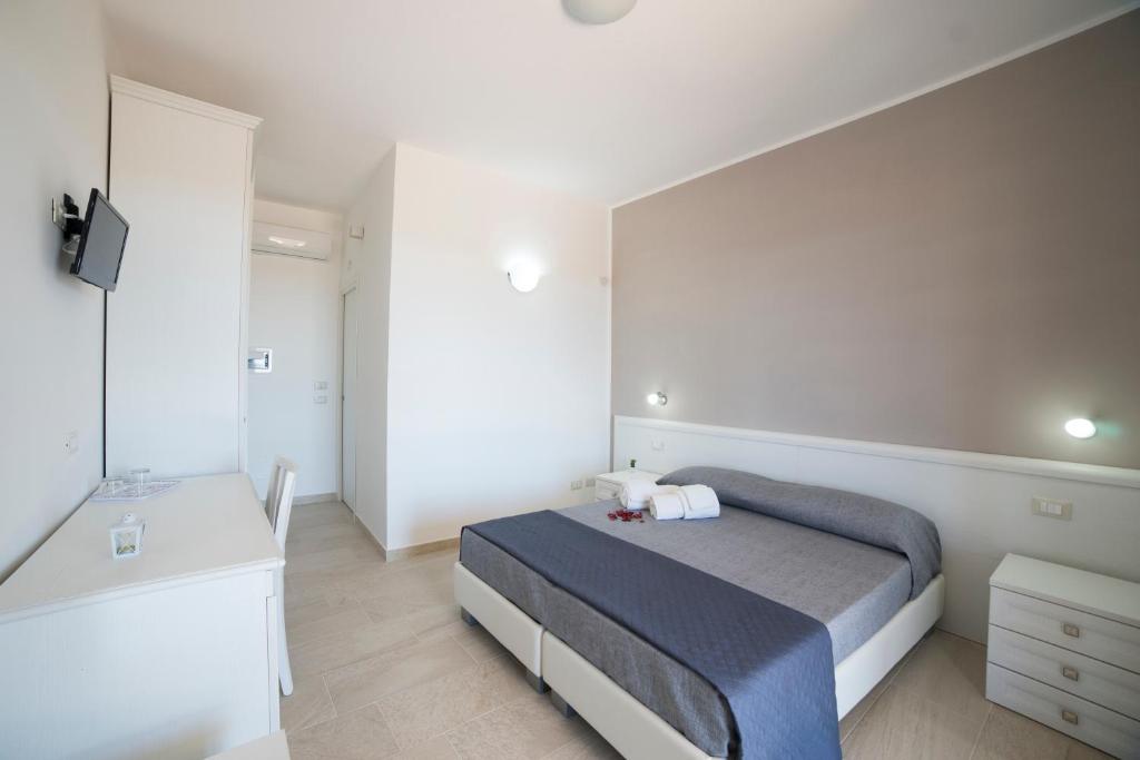 Ένα ή περισσότερα κρεβάτια σε δωμάτιο στο Raggio Di Sale