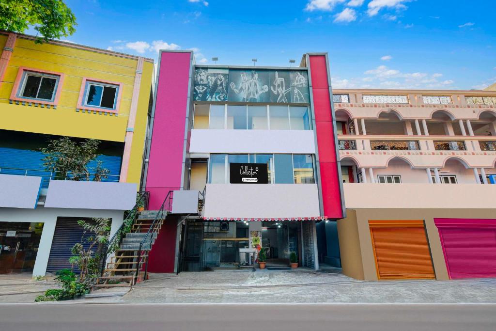 a colorful building with colorful doors and windows at Collection O Neredmet Road in Hyderabad