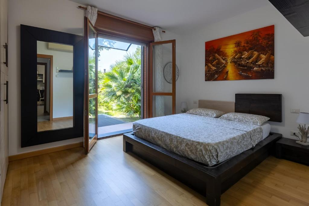 Postel nebo postele na pokoji v ubytování House Garden Milano