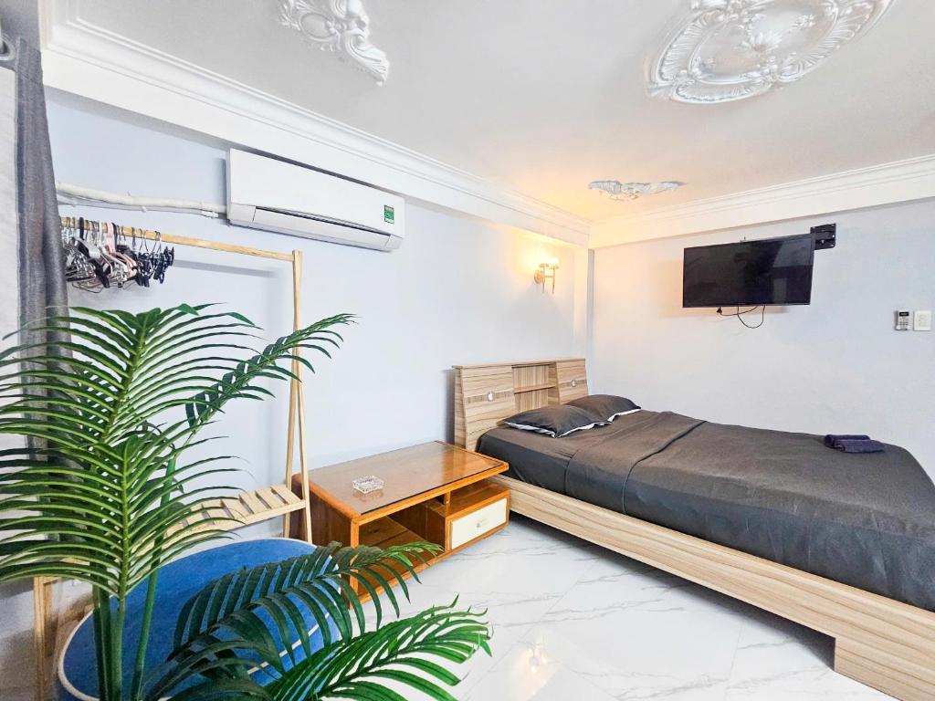 En eller flere senge i et værelse på H2T Hotel Vip