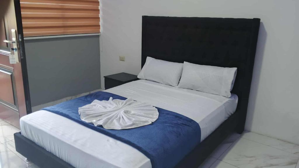 Кровать или кровати в номере hostal el paraiso