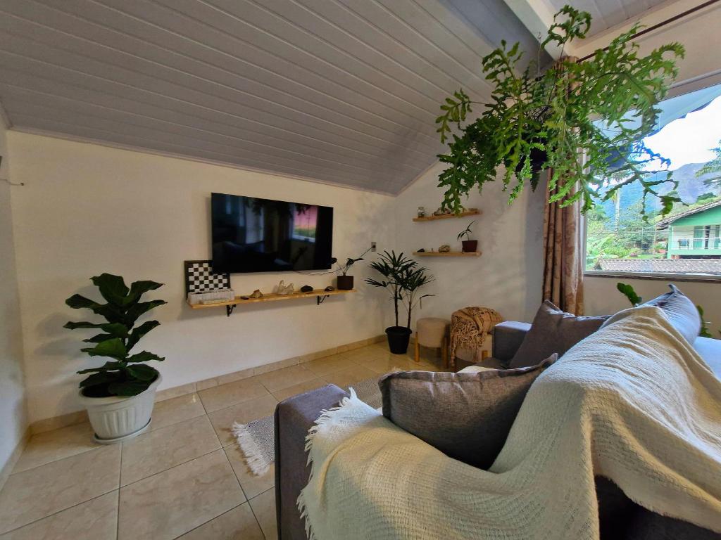 Μια τηλεόραση ή/και κέντρο ψυχαγωγίας στο Casa das Andorinhas - Natureza e charme em Lumiar