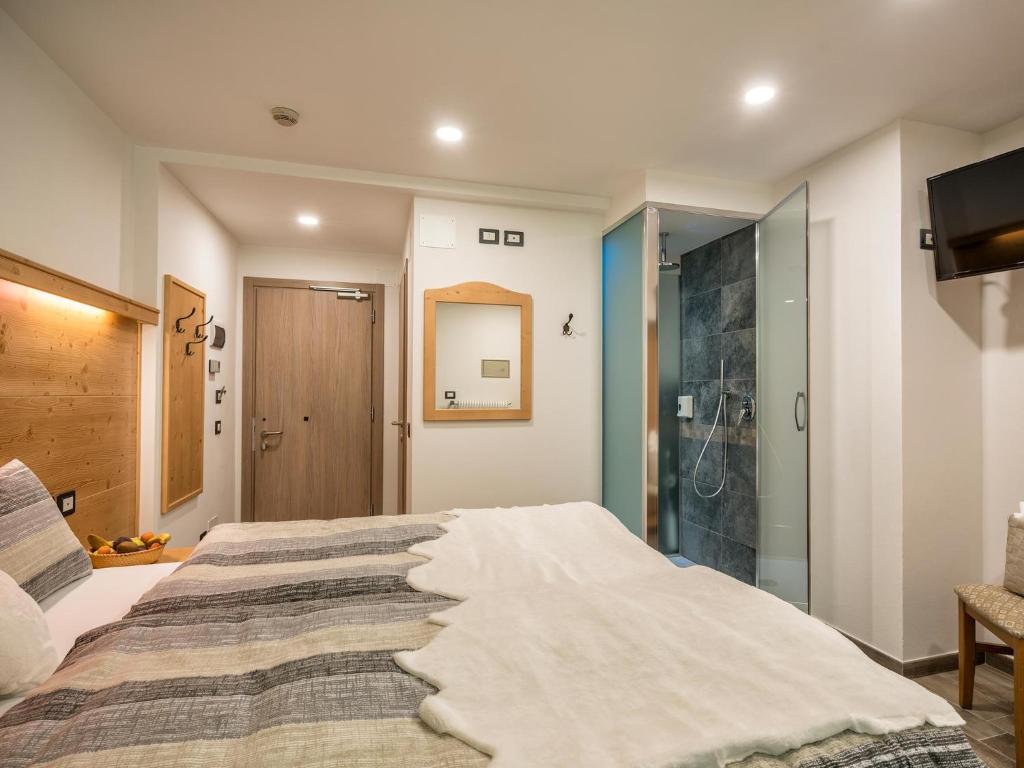 Postel nebo postele na pokoji v ubytování Albergo Panorama