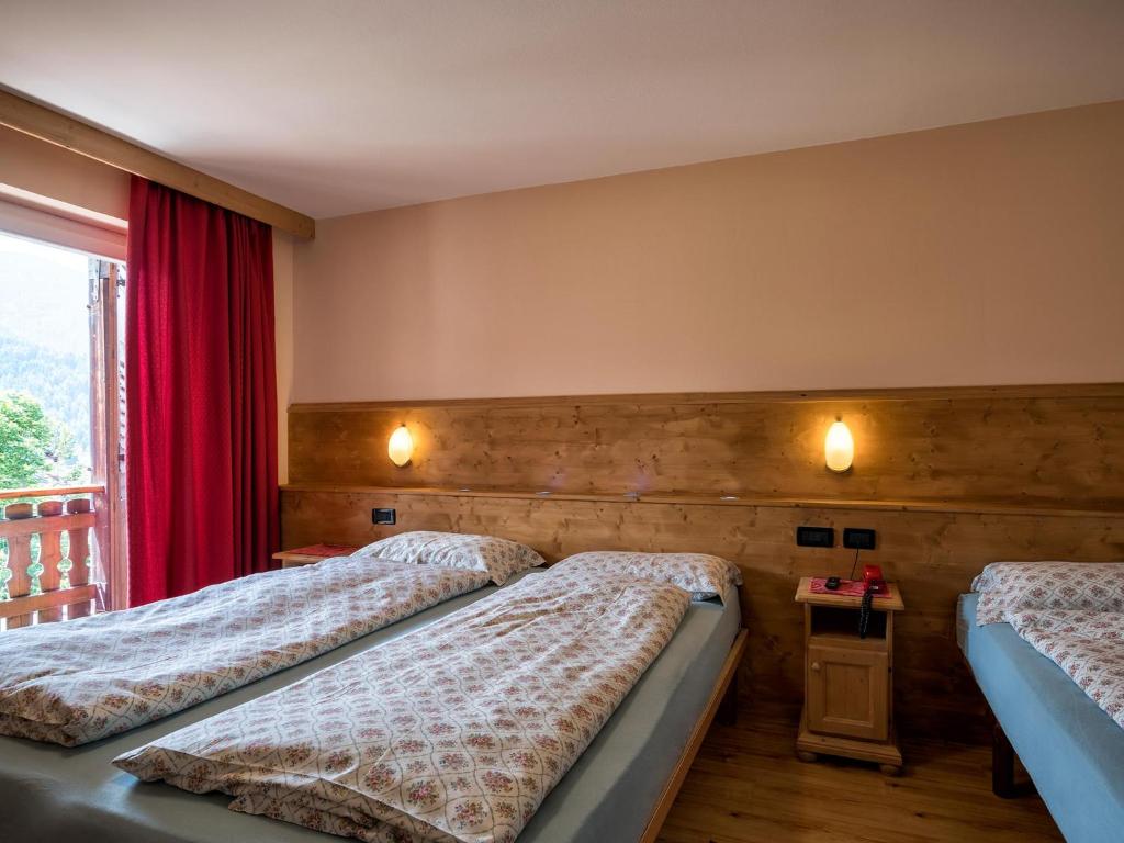 Postel nebo postele na pokoji v ubytování Albergo Panorama