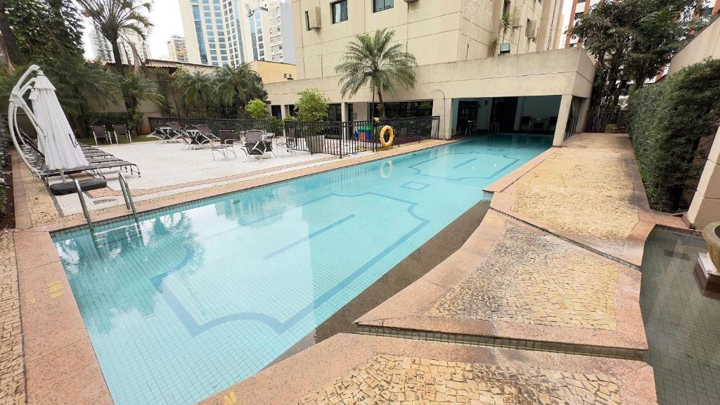a large swimming pool in the middle of a building at TrevizZo Mercure! in Sao Paulo