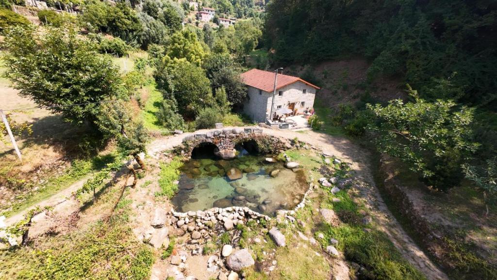 an aerial view of a small house on a mountain at Casa Museu Lagar de Azeite in Terras de Bouro