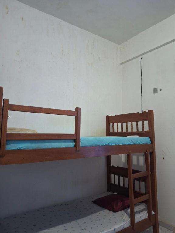 a bedroom with two bunk beds in a room at Aconchego benevides Barcelona in Benevides