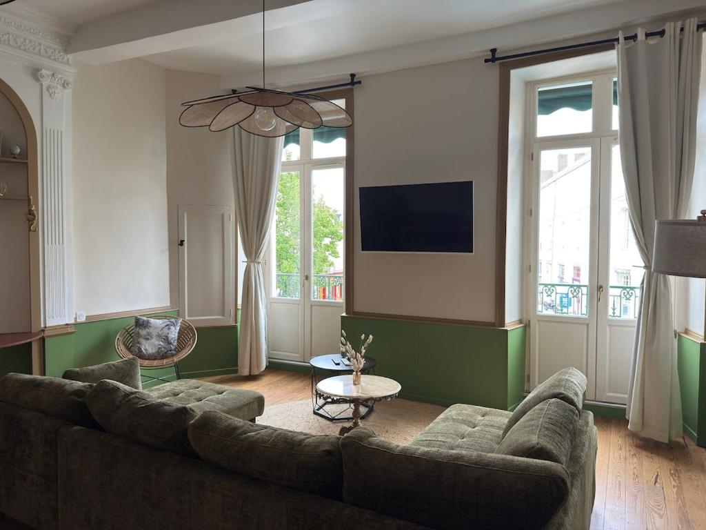 TV a/nebo společenská místnost v ubytování OHANA Appartement de charme