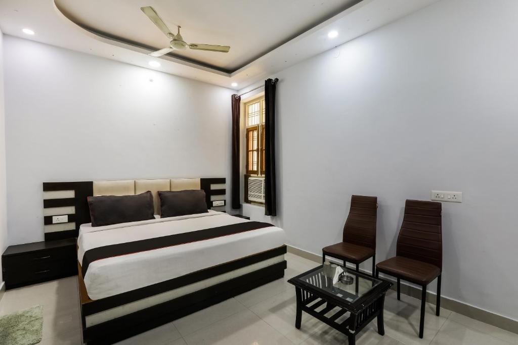 Ένα ή περισσότερα κρεβάτια σε δωμάτιο στο Hotel O Kiara Inn