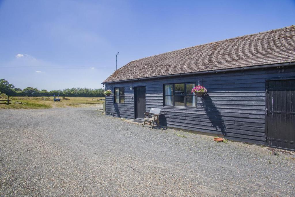 a blue building with a bench in front of it at 1 Bed in Great Sampford oc-f32654 in Great Sampford
