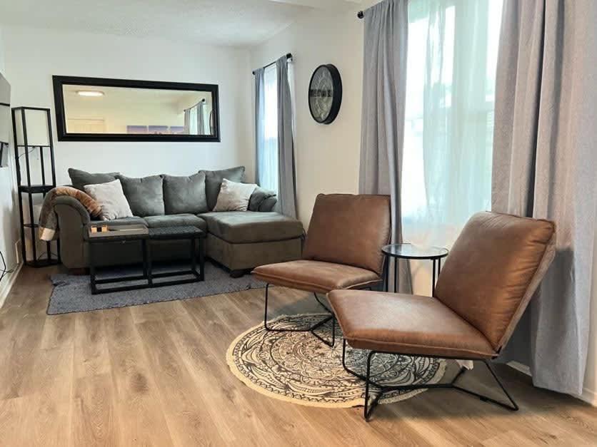 a living room with a couch and two chairs at Modern & Renovated 3BR 1BA Home - Quiet & Cozy in Madison Heights
