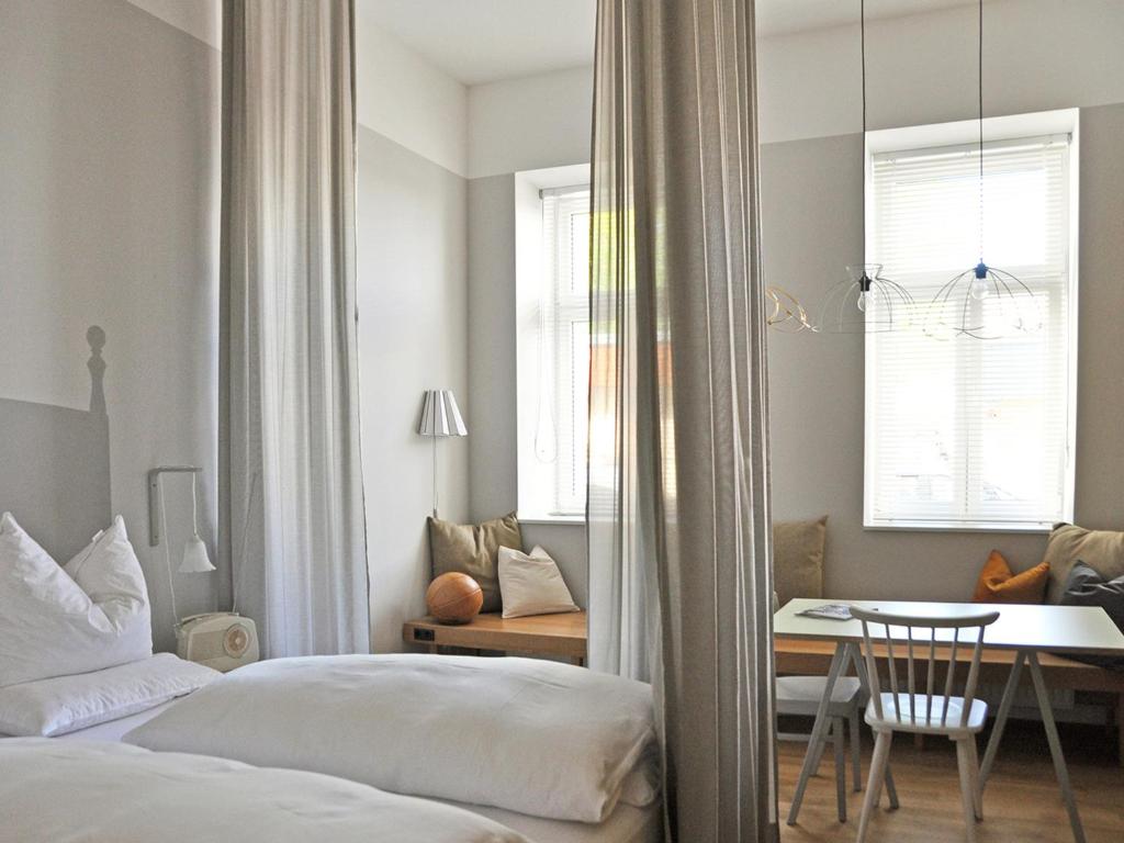 Postel nebo postele na pokoji v ubytování grätzlhotel Schönbrunn