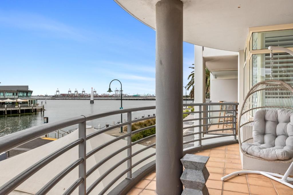 a balcony of a house with a view of the water at Scenic Beachside 3-bedroom with Water Views in Melbourne