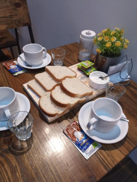 a table with a bunch of slices of bread on it at Hotel Gutierrez in Mendoza
