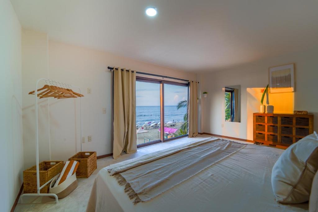 Ένα ή περισσότερα κρεβάτια σε δωμάτιο στο Maramara Playa Beach Hotel