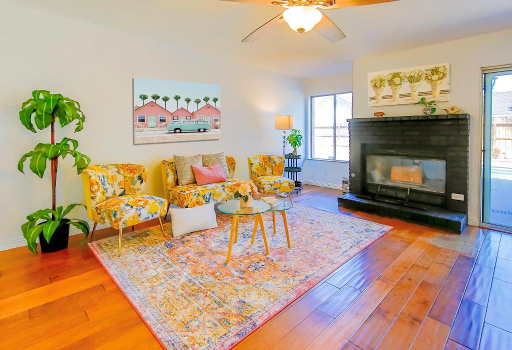 a living room with a couch and a fireplace at Cozy Room#1 Best Moscato in Clovis
