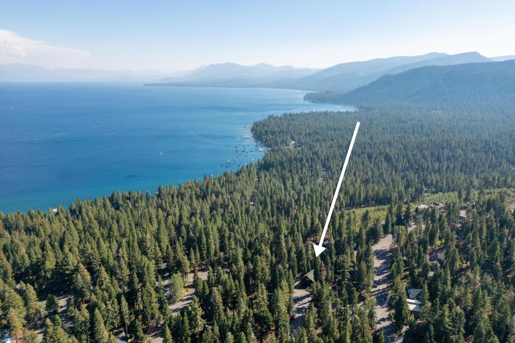 an aerial view of a lake and trees at Emerald Lodge at Tahoe Park by Tahoe Getaways - 4BR w HOA Beach & Air Conditioning in Tahoe Park