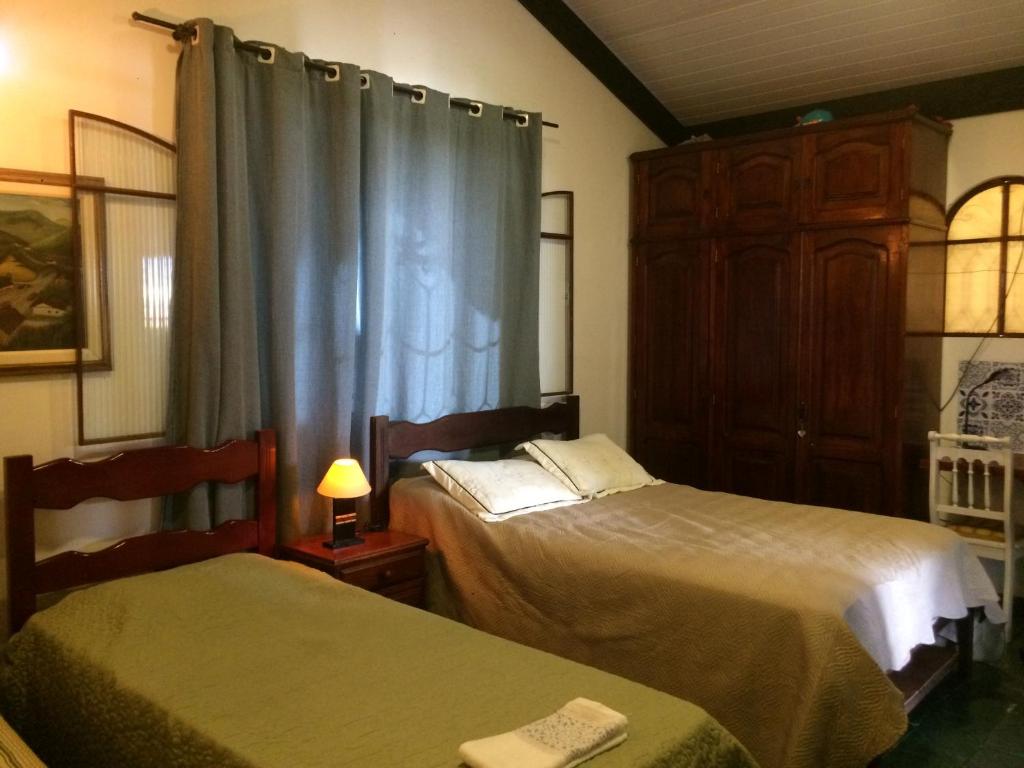 Ένα ή περισσότερα κρεβάτια σε δωμάτιο στο Recanto das Águas Claras