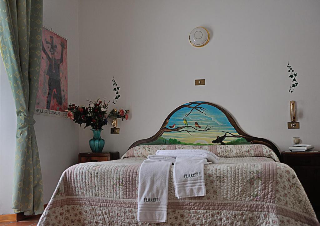 Postel nebo postele na pokoji v ubytování Albergo Ristorante Ferretti