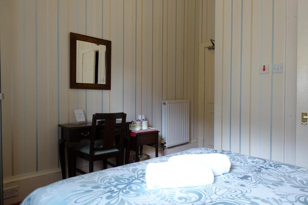 Postel nebo postele na pokoji v ubytování Ashgrove House