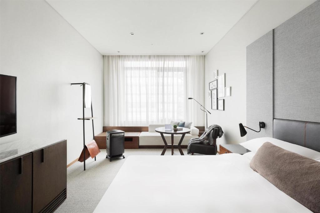 新竹伊普索凱悅尚選酒店房間的床