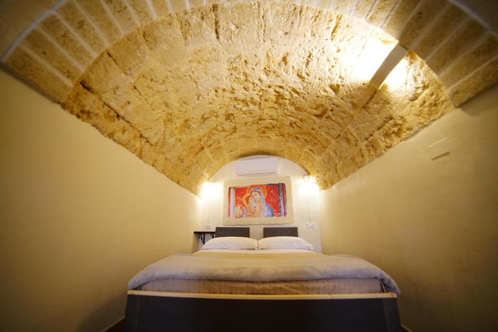 Postel nebo postele na pokoji v ubytování La Pergola ai Sassi