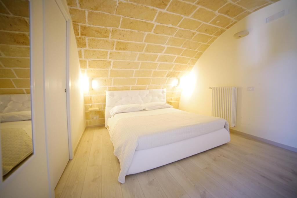 Postel nebo postele na pokoji v ubytování La Pergola ai Sassi