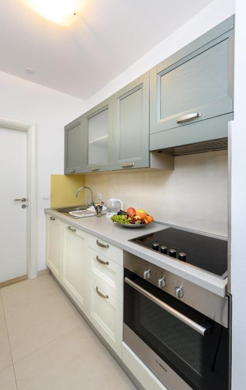 Kuchyňa alebo kuchynka v ubytovaní Apartments Domani