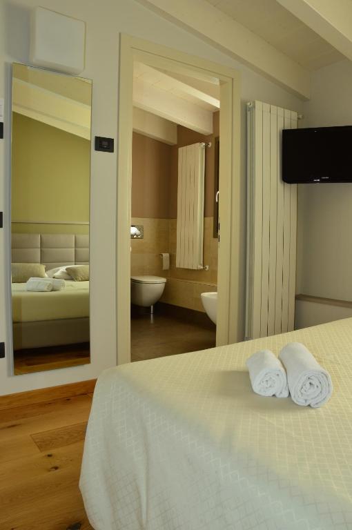 Postel nebo postele na pokoji v ubytování Locanda Blum In