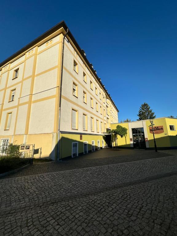 a large building on the side of a street at AltstadtQuartier in Schwedt
