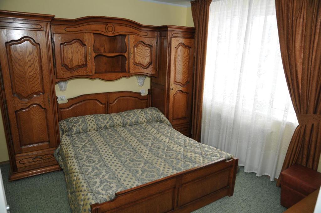 Letto o letti in una camera di Pensiunea Lory