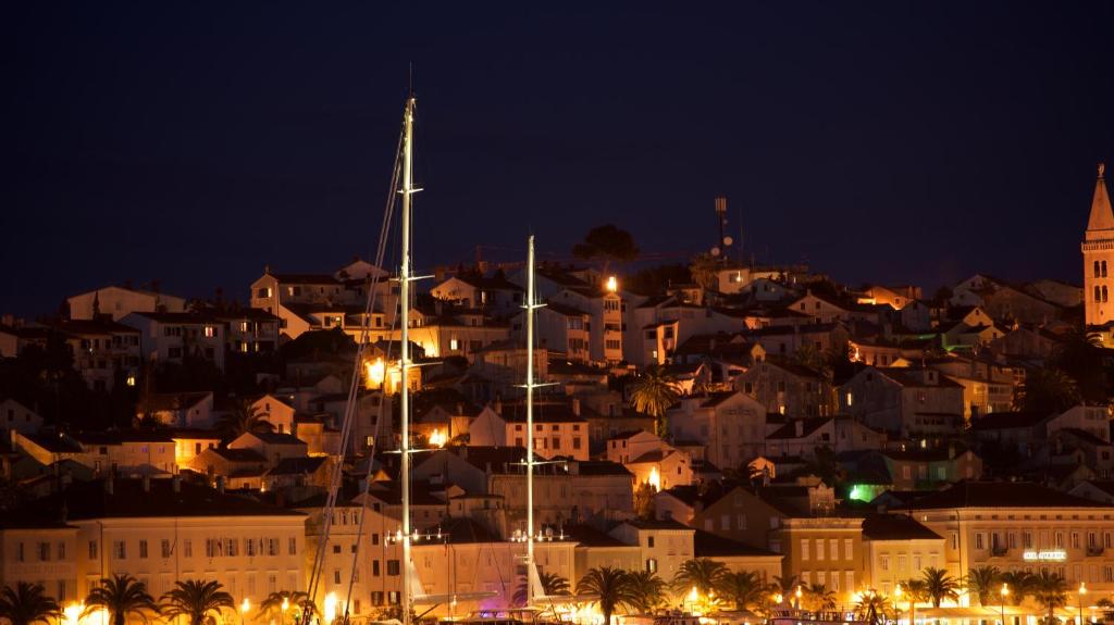 a view of a city at night at Apartment Terra in Mali Lošinj