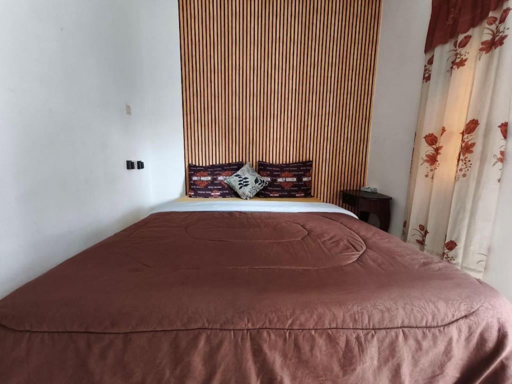 Кровать или кровати в номере Gangga Villa Bromo