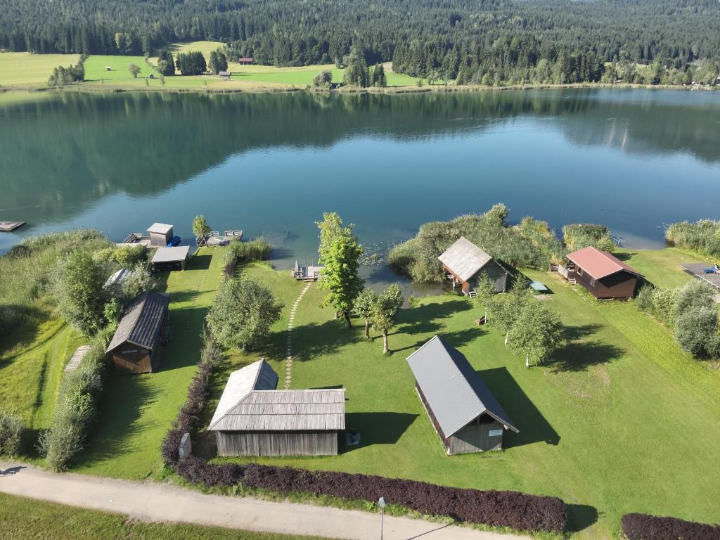 an aerial view of a lake with a group of resorts at Haus Stampfer in Weissensee
