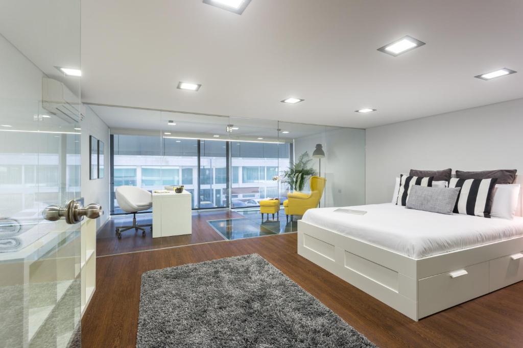 Ένα ή περισσότερα κρεβάτια σε δωμάτιο στο Aveiro Urban Loft
