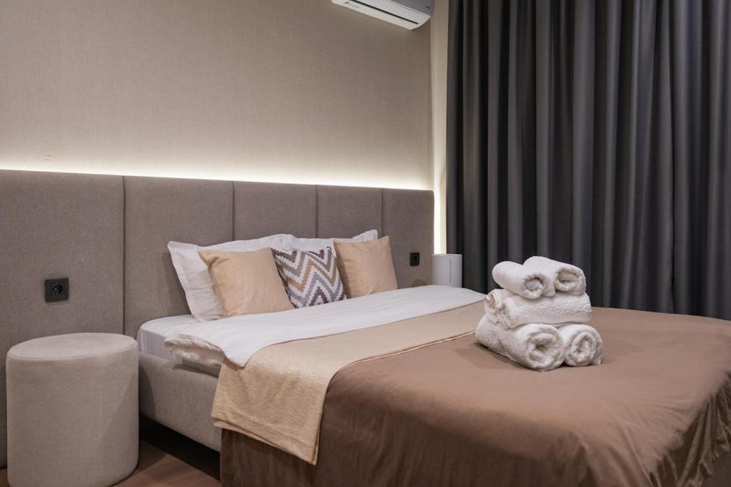 Katil atau katil-katil dalam bilik di Luxury apartment in the center of Tashkent in NRG U-Tower