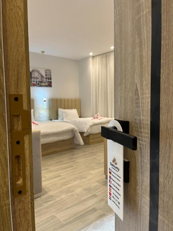 Ένα ή περισσότερα κρεβάτια σε δωμάτιο στο Saloumy pyramids hotel