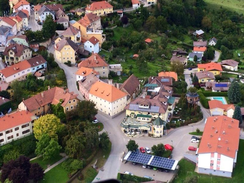 an aerial view of a small town with buildings at Hotel Prechtlhof in Althofen