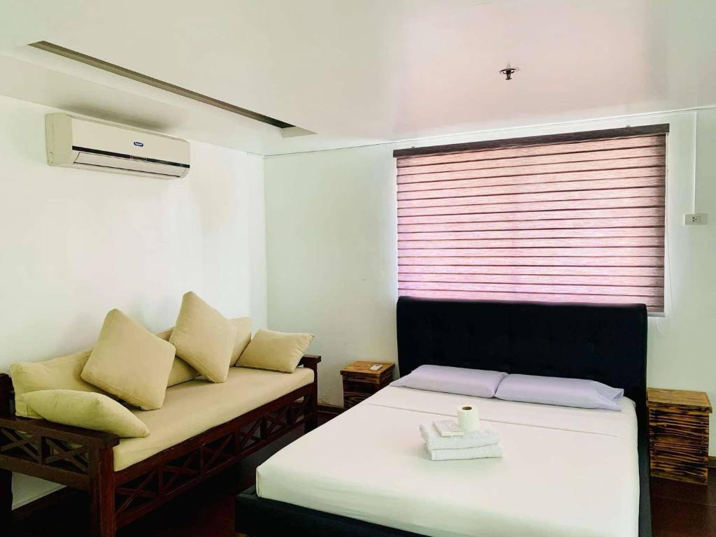 Postel nebo postele na pokoji v ubytování The Seaside Residences