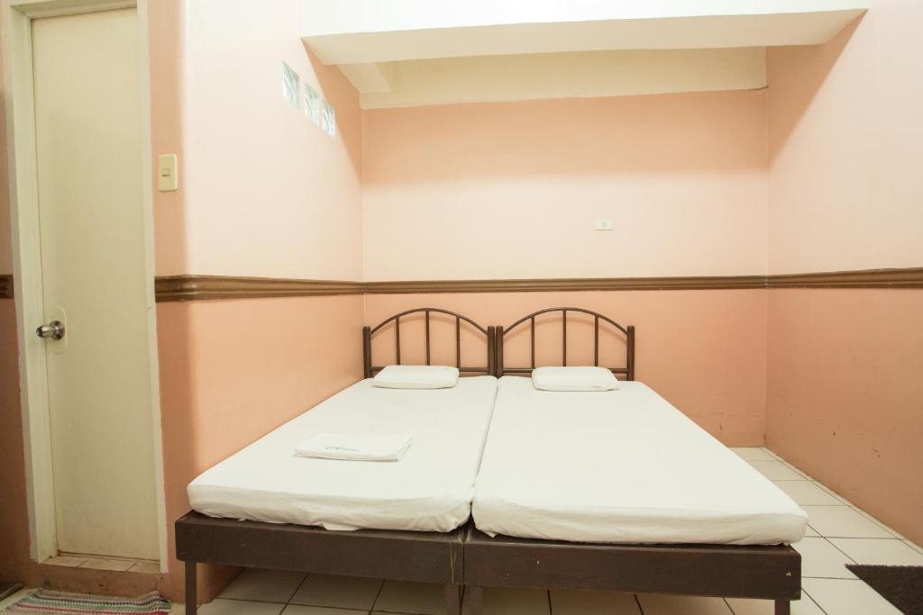 Postel nebo postele na pokoji v ubytování GV Hotel - Masbate