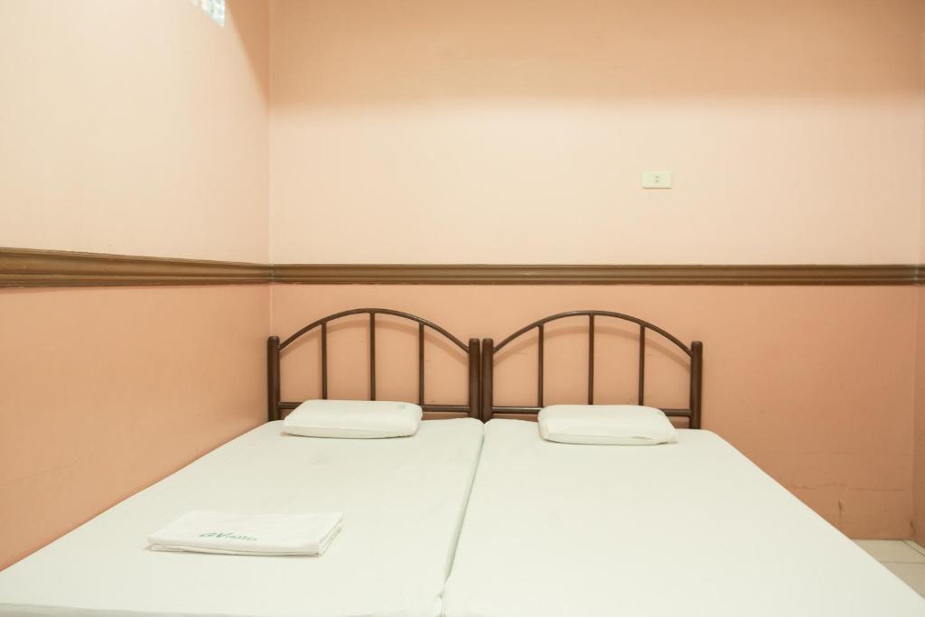 Postel nebo postele na pokoji v ubytování GV Hotel - Masbate