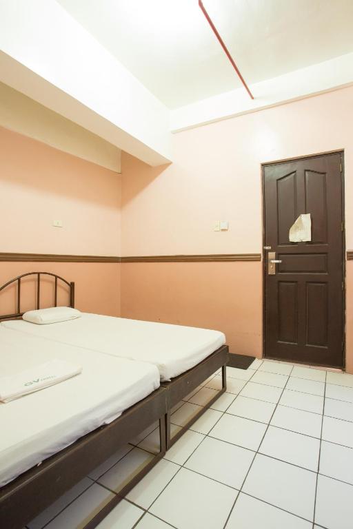 Postel nebo postele na pokoji v ubytování GV Hotel - Masbate