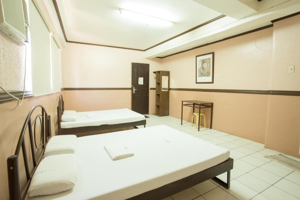 Postel nebo postele na pokoji v ubytování GV Hotel - Masbate