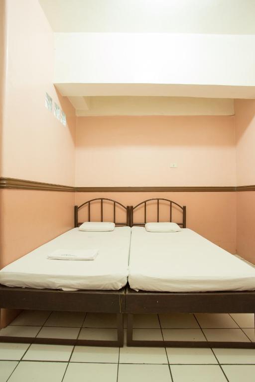 Postel nebo postele na pokoji v ubytování GV Hotel - Masbate