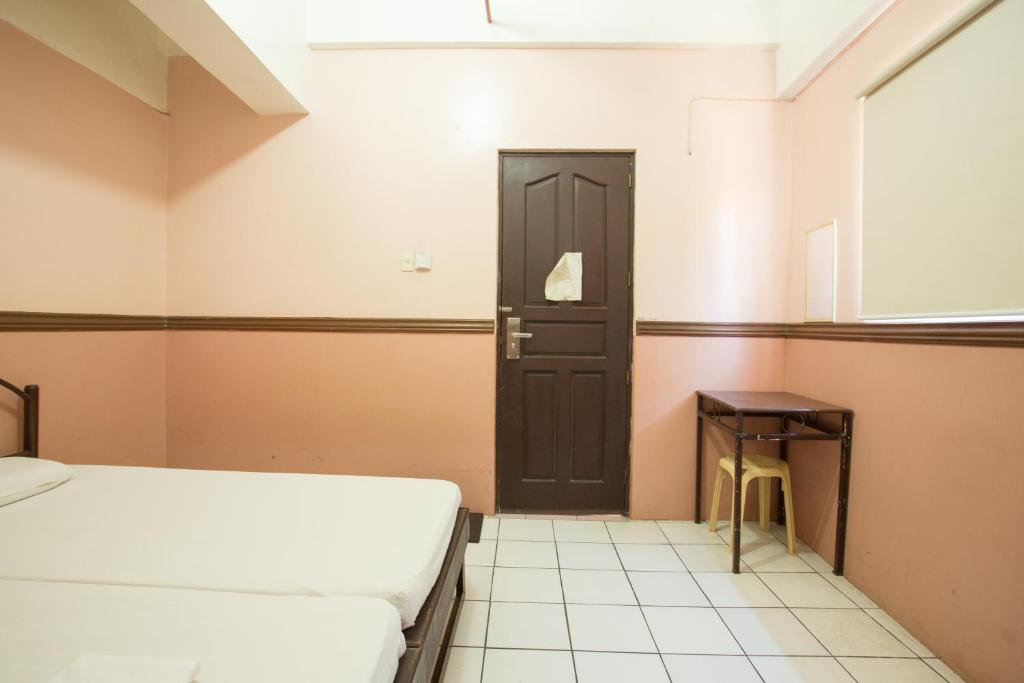 Postel nebo postele na pokoji v ubytování GV Hotel - Masbate