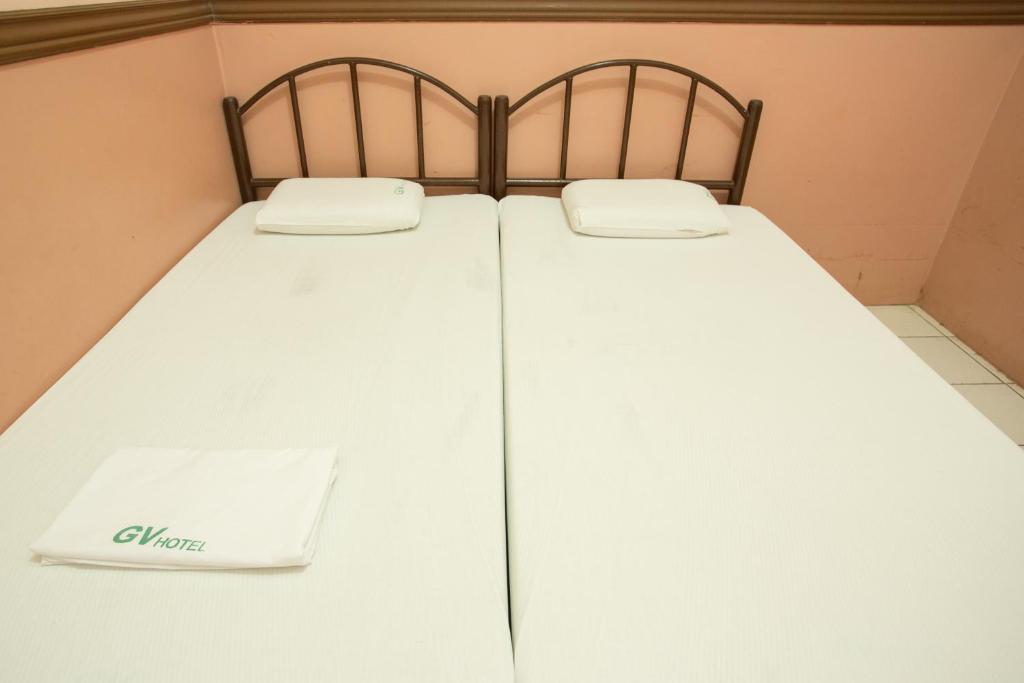 Postel nebo postele na pokoji v ubytování GV Hotel - Masbate