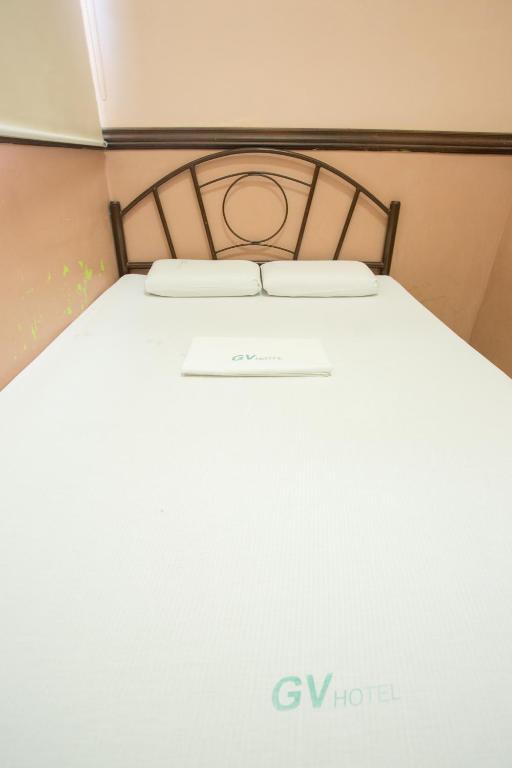 Postel nebo postele na pokoji v ubytování GV Hotel - Masbate