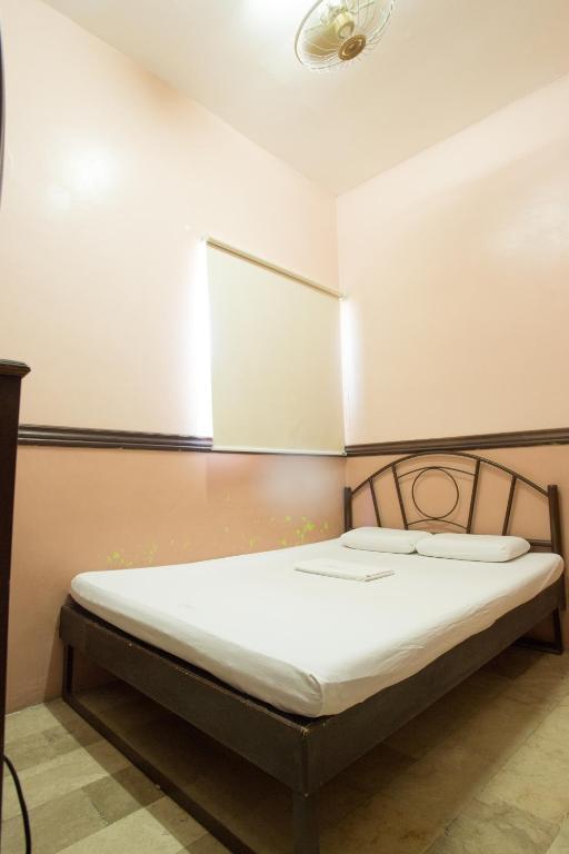 Postel nebo postele na pokoji v ubytování GV Hotel - Masbate