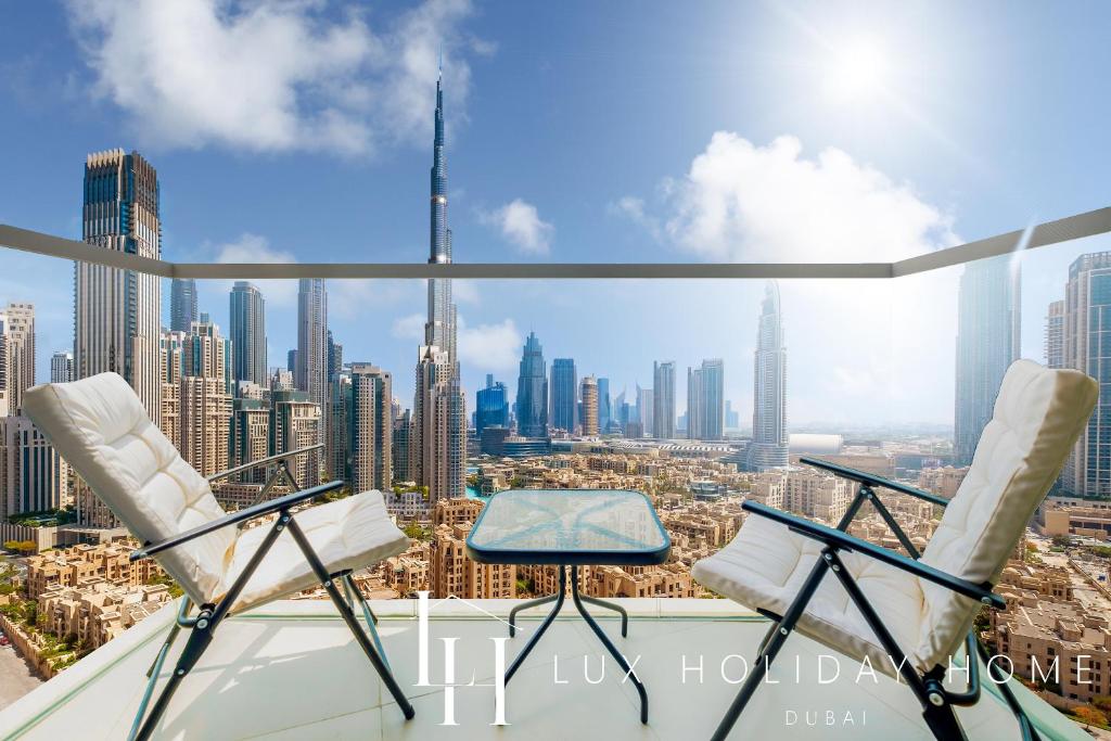 Dubai high-rise balcony vape, Executive vaping Burj Khalifa view, Sleek vape with suit Dubai - LUX The Executive Burj Khalifa View Suite, Dubai (updated prices 2026)